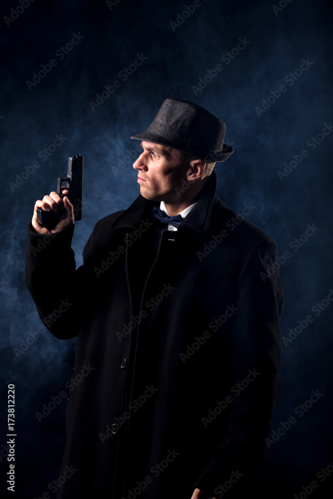 detective or criminal with gun on foggy night background detective or criminal with gun on foggy night background