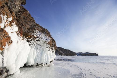 Icicles in Oltrek island rock. Winter landscape of Lake Baikal. photo