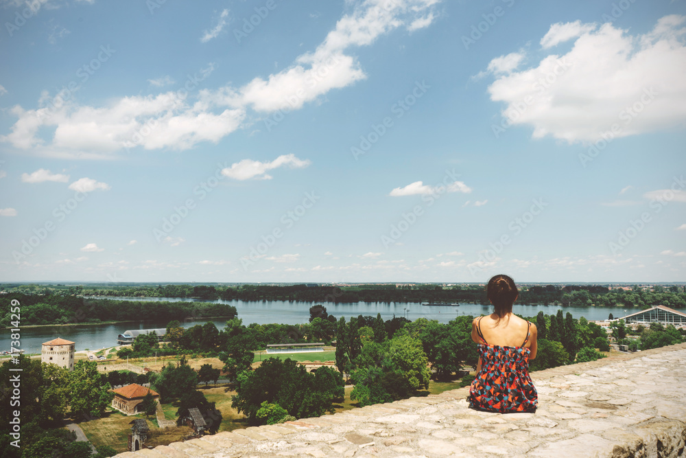 Girl looking the view of Sava and Danube rivers, on Belgrade, Serbia.