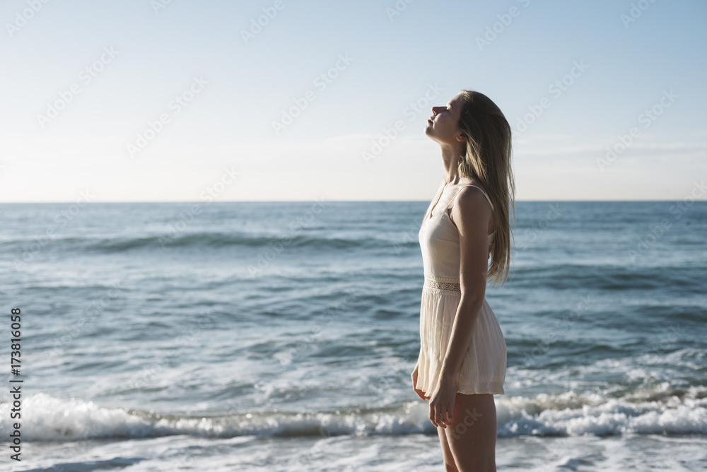 Beautiful young woman relaxing at the beach Beautiful young woman relaxing at the beach