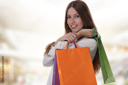 Portrait of beautiful woman holding shopping bags