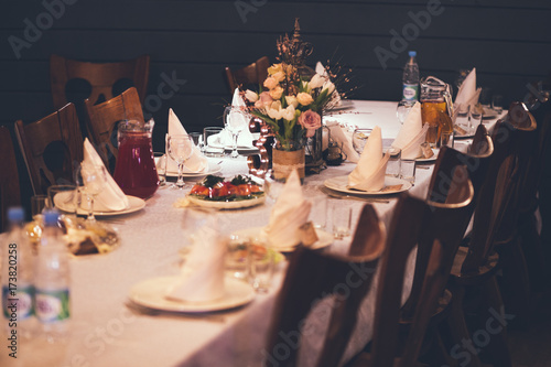 Bild auf Leinwand Elegant Restaurant Table with flowers and dishes
