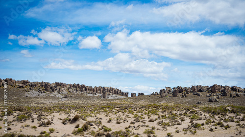 High altitude landscape with harsh barren landscape and scenic dramatic sky. Wide angle view from above at 4000 m on the Andean highlands  Peru.