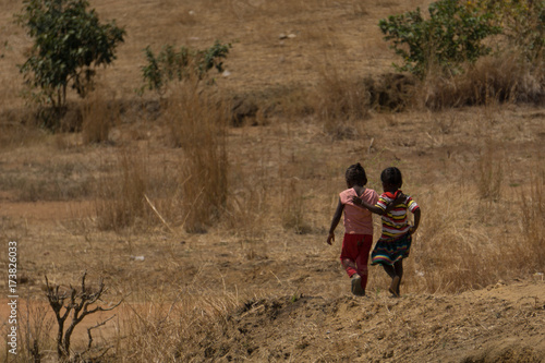 Friends walking together in Madagascar's bush