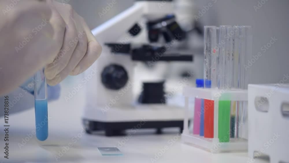 Close up on male researcher preparing samples in laboratory Close up on male researcher preparing samples in laboratory