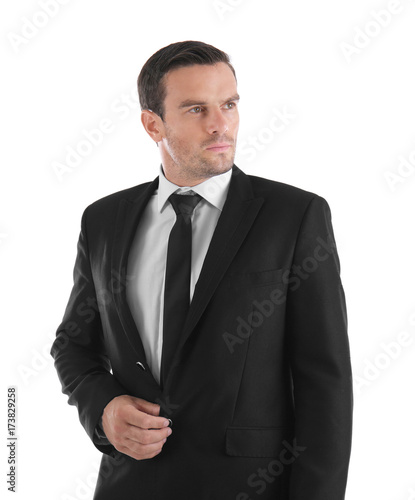 Handsome man in elegant black suit on white background