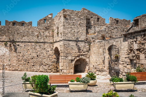 Wooden benches near old ruins of Rhodes town on Rhodes island photo