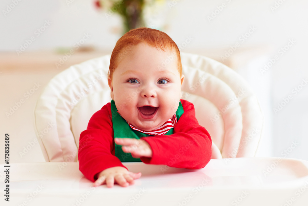 cute happy infant baby boy in elf costume sitting in highchair cute happy infant baby boy in elf costume sitting in highchair