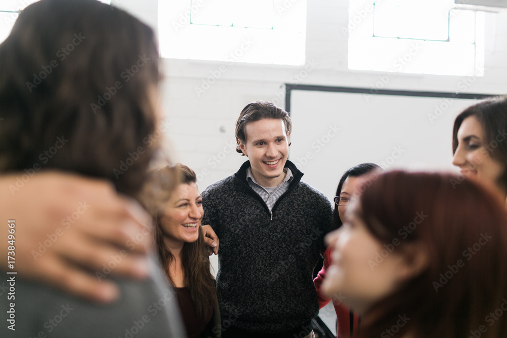 Group of people with their arms around each other Group of people with their arms around each other