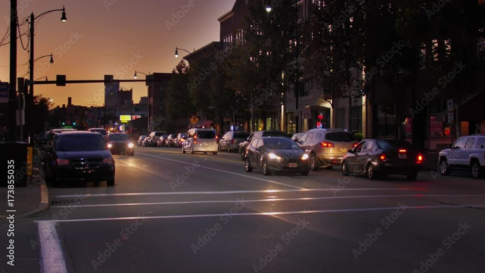 An evening sunset establishing shot of traffic and buildings along East Carson Street in Pittsburgh's South Side district. An evening sunset establishing shot of traffic and buildings along East Carson Street in Pittsburgh's South Side district.