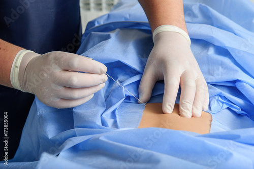 Doctor during spine operation in operating room