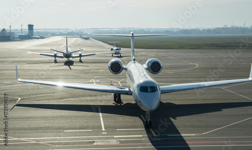 Private jet planes on the landing line in the morning time.