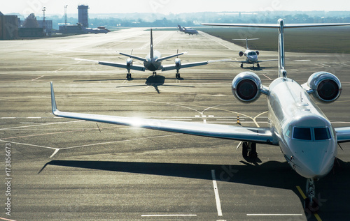 Private jet planes on the landing line in the morning time.