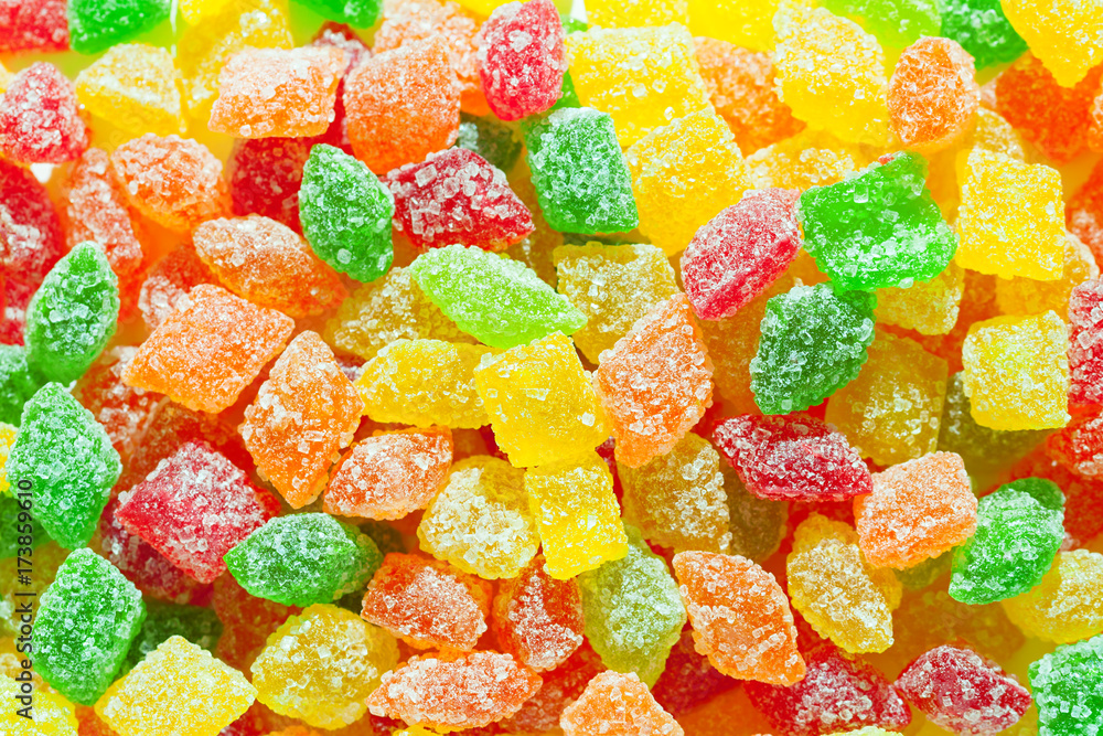 close up a background from colorful sweets of sugar candies. close up a background from colorful sweets of sugar candies.