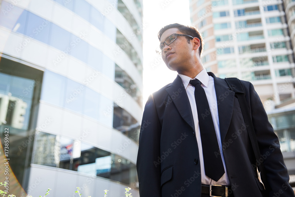 Young asian businessman working outdoors Young asian businessman working outdoors