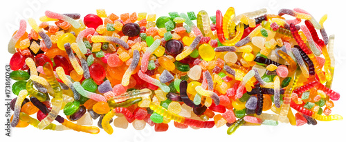 panorama close up a background from colorful sweets of sugar candies and marmalade.