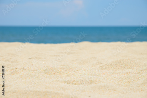 Closeup of sand on the beach and blue sky background