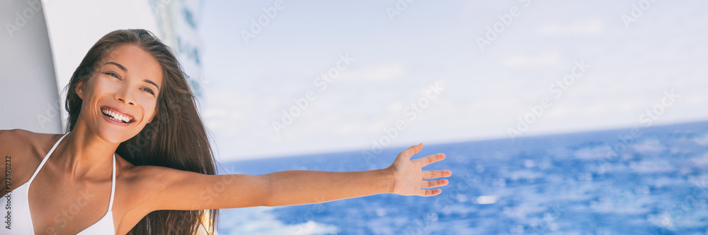 Cruise ship vacation travel fun freedom woman. Asian tourist girl on holidays feeling free with open arms towards ocean water on Caribbean getaway holiday. Cruise ship vacation travel fun freedom woman. Asian tourist girl on holidays feeling free with open arms towards ocean water on Caribbean getaway holiday.