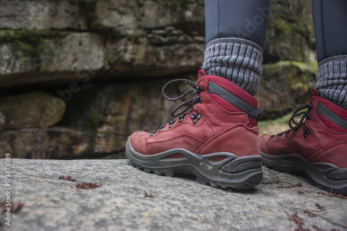 girl in red hiking boots with socks and legging