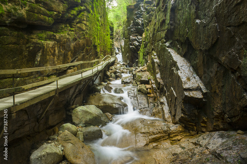 long suspended bridge over surrounded by rocks in new hampshire