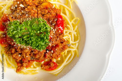 spaghetti bolognese on white background