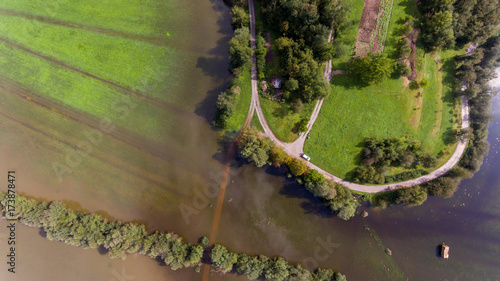 Aerial view of road surrounded with water. photo