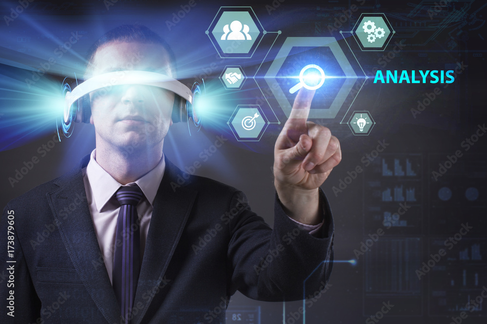 Obraz premium Business, Technology, Internet and network concept. Young businessman working in virtual reality glasses sees the inscription: Analysis