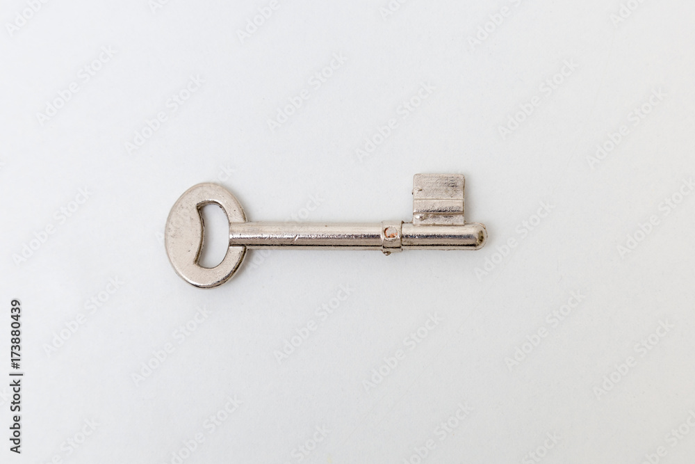 Key isolated on white background. Studio lighting. Key isolated on white background. Studio lighting.