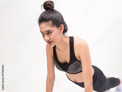 Happy young fitness woman. Studio shot on white background.  Fitness and health concept © PRASERT