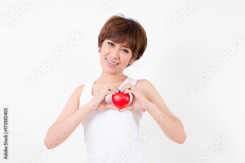 Beautiful young asia woman with red heart. Isolated on white background. Studio lighting. Concept for healthy.