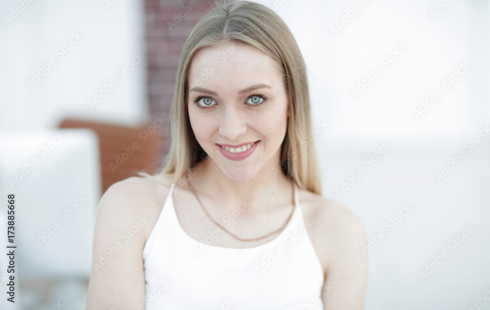 close-up portrait of a young woman on a blurred office background. close-up portrait of a young woman on a blurred office background.