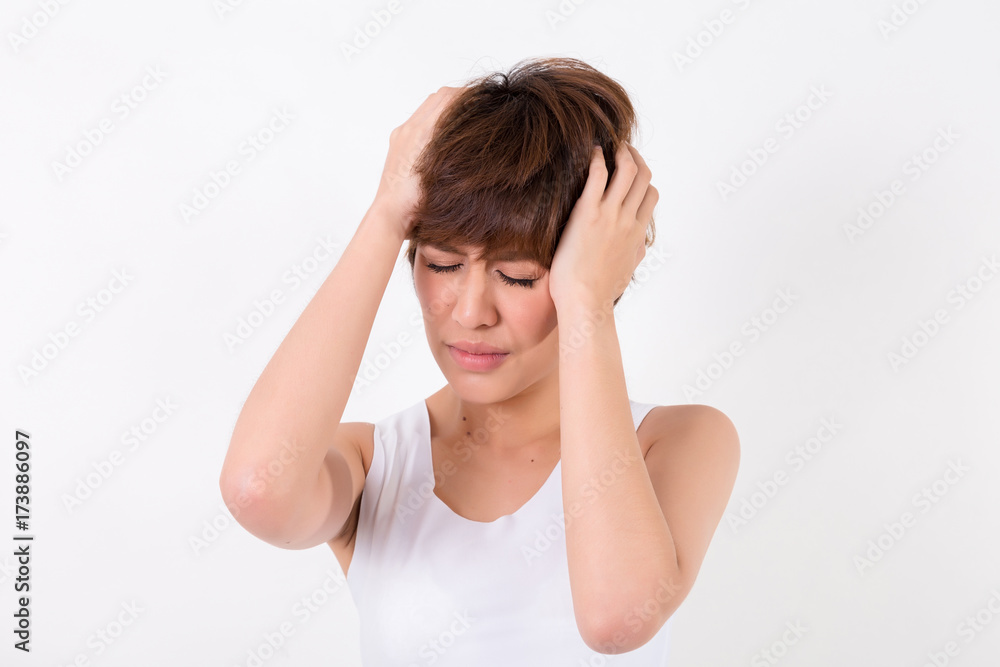 Health and pain. Stressed exhausted young woman having strong tension headache. Isolated on white background. Studio lighting. Concept for healthy and medical Health and pain. Stressed exhausted young woman having strong tension headache. Isolated on white background. Studio lighting. Concept for healthy and medical
