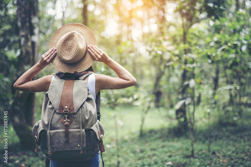 Tableau sur toile happy female tourist to travel in wild trip  hiking during vacation