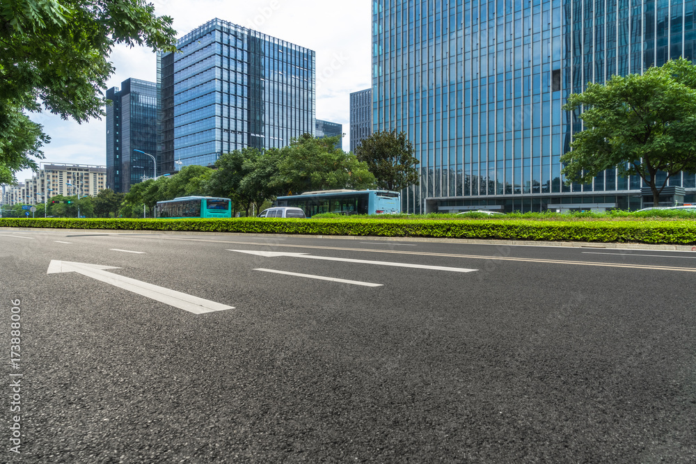city empty traffic road with cityscape in background. city empty traffic road with cityscape in background.