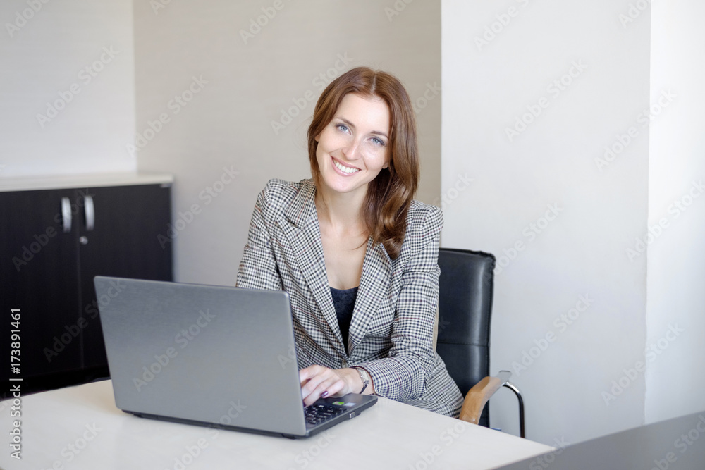 Successful business woman working at the office Successful business woman working at the office