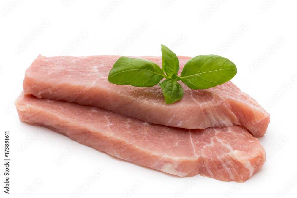 Fresh pork fillet with basil on a white background. Fresh pork fillet with basil on a white background.