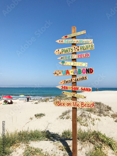 Direction signpost on the beach
