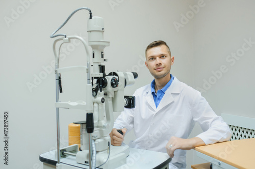 Young beautiful doctor/eye specialist/optometrist in an ophthalmologic clinic