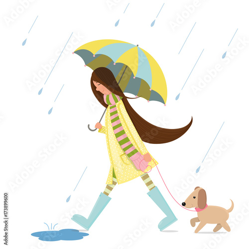 A girl is walking with a dog.