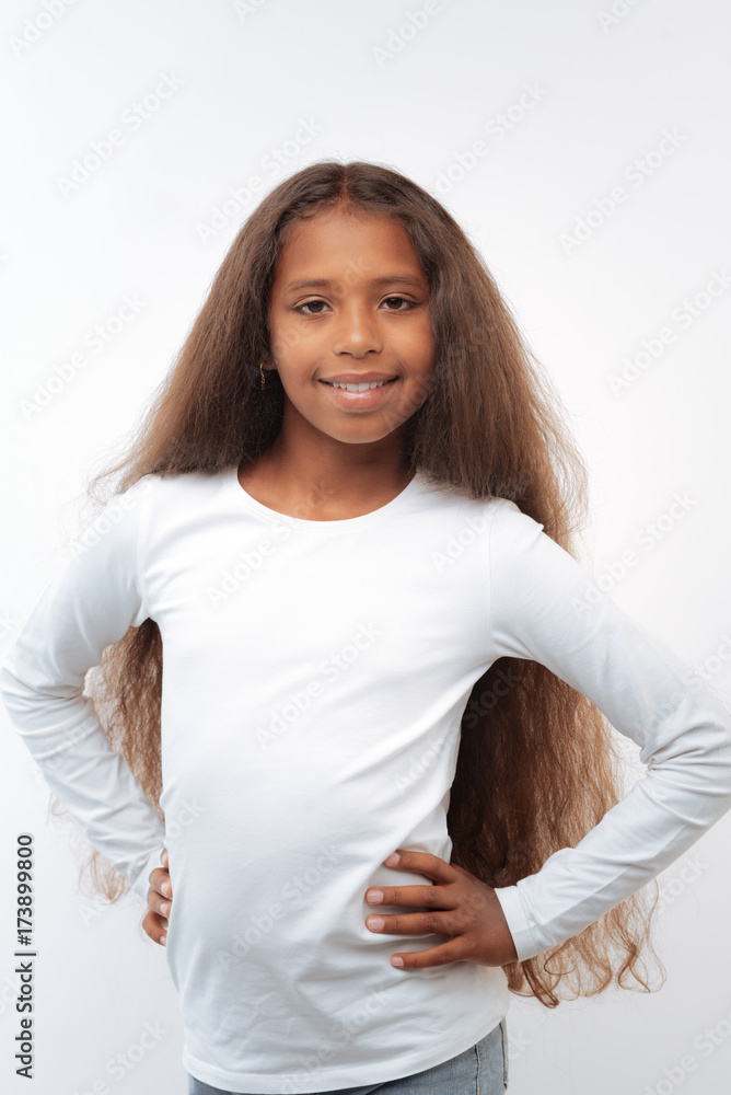 Pretty girl posing on white background with hands on waist Stock Photo ...