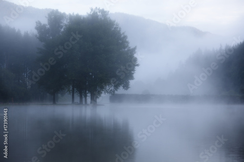 Lake at foggy morning misty weather