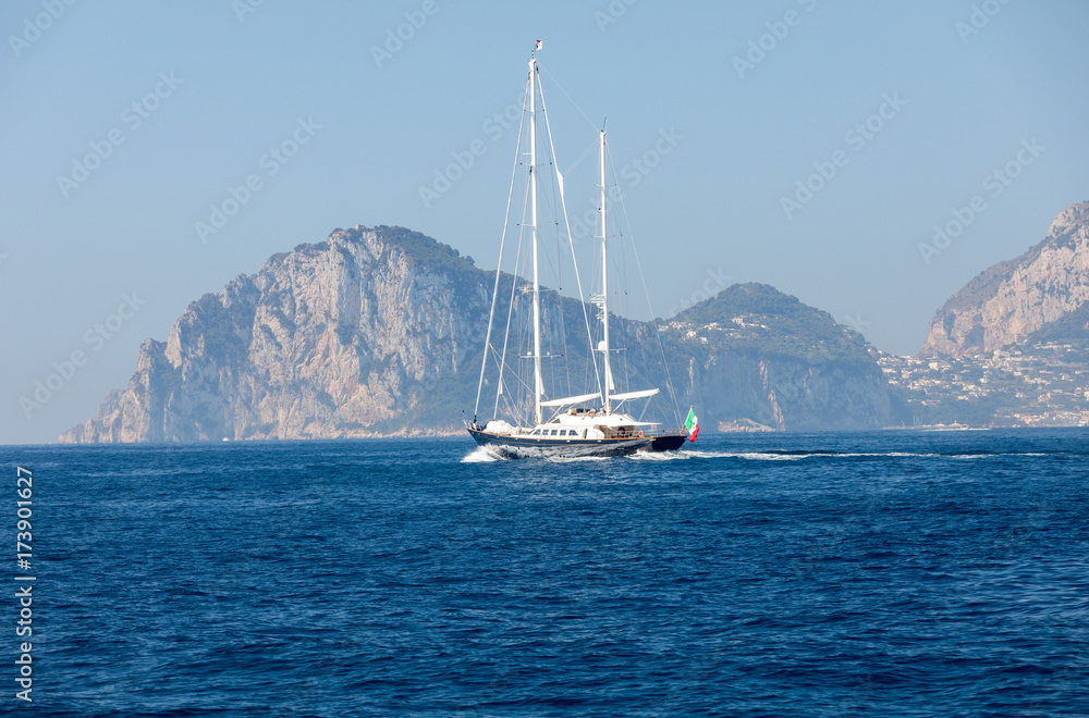 The Island of Capri is a very picturesque, luxuriant and extraordinary location in Italy famous for its high rocks. The Island of Capri is a very picturesque, luxuriant and extraordinary location in Italy famous for its high rocks.