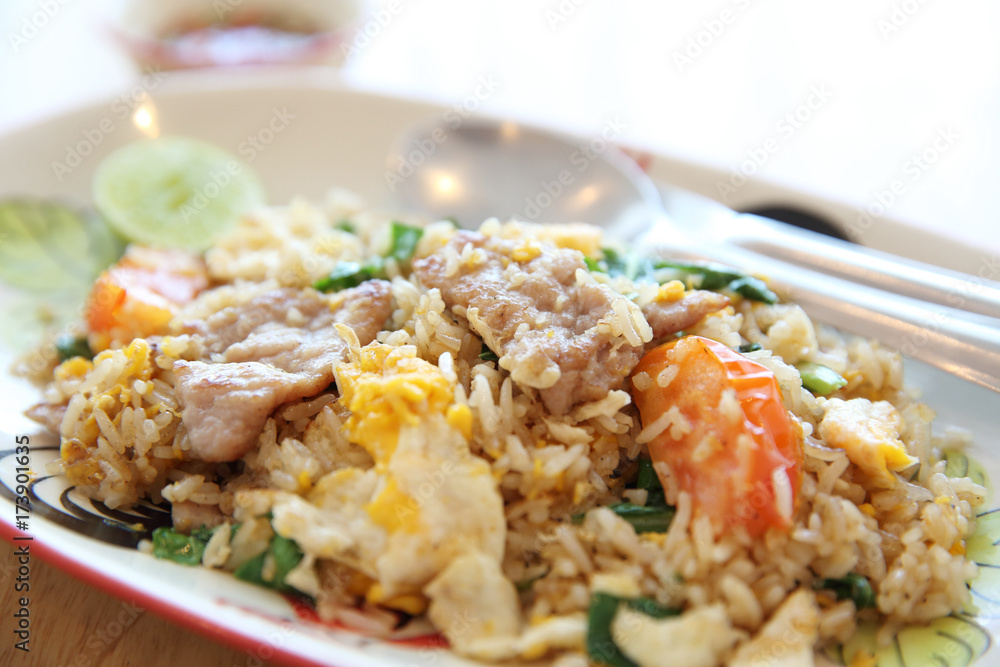 Pork fried rice with lime on wood background , Thai food Pork fried rice with lime on wood background , Thai food