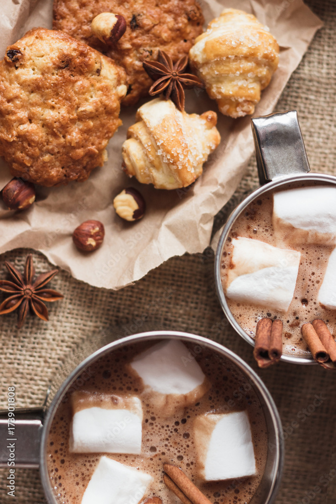 Metal mugs with cacao and marshmallow