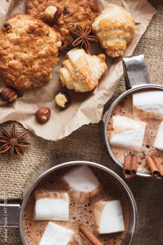 Metal mugs with cacao and marshmallow