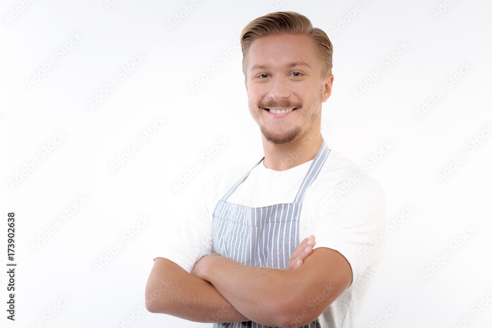 Fair-haired man posing with his arms folded across chest Fair-haired man posing with his arms folded across chest