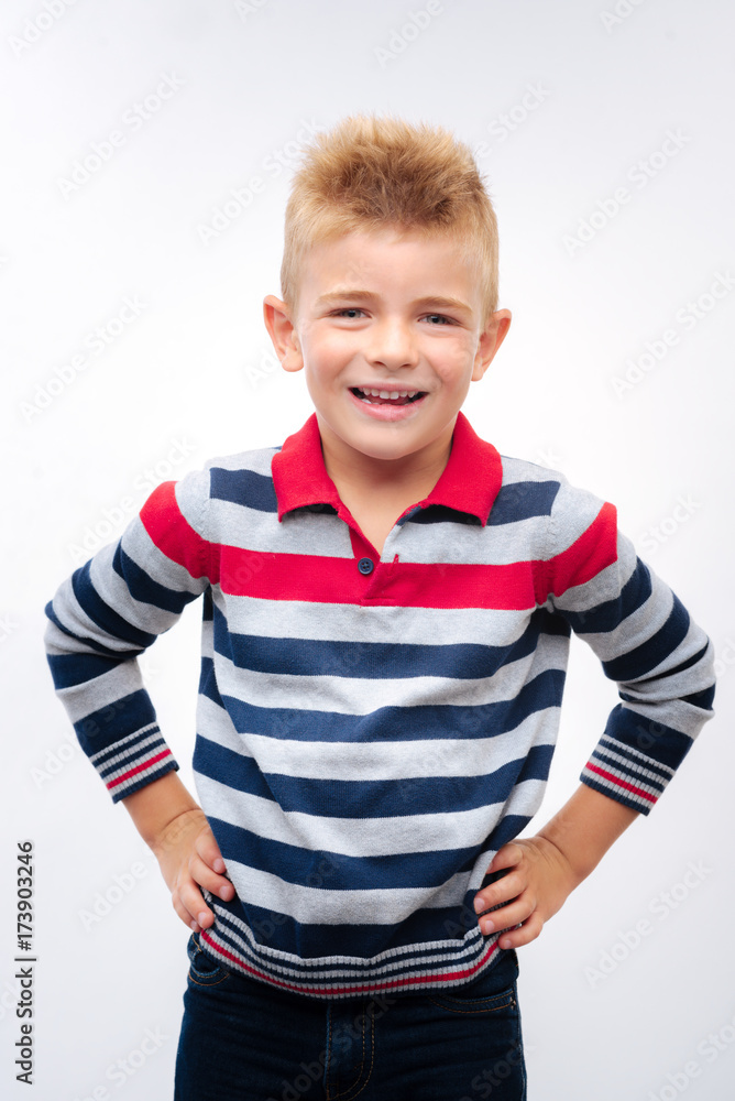 Adorable little boy posing with hands on waist Adorable little boy posing with hands on waist