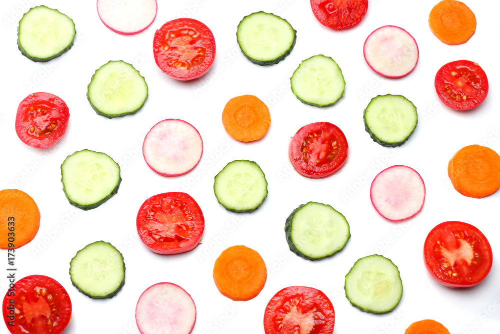 mix of sliced cucumber with sliced carrot and tomato isolated on a white background top view mix of sliced cucumber with sliced carrot and tomato isolated on a white background top view
