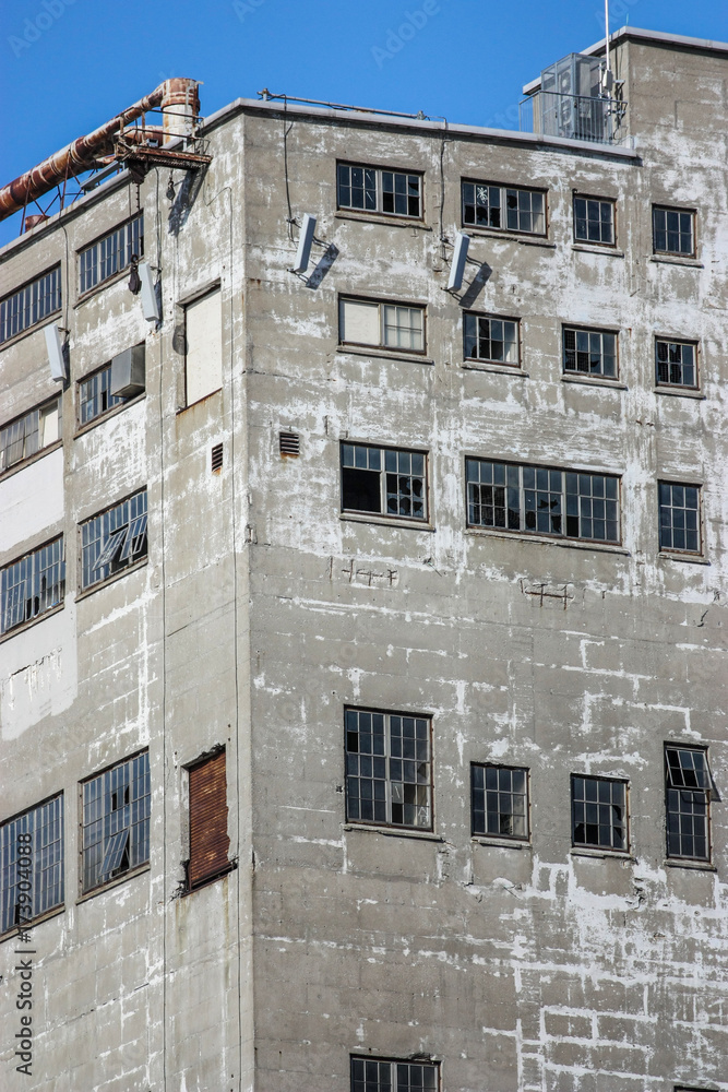 old industrial building with broken windows