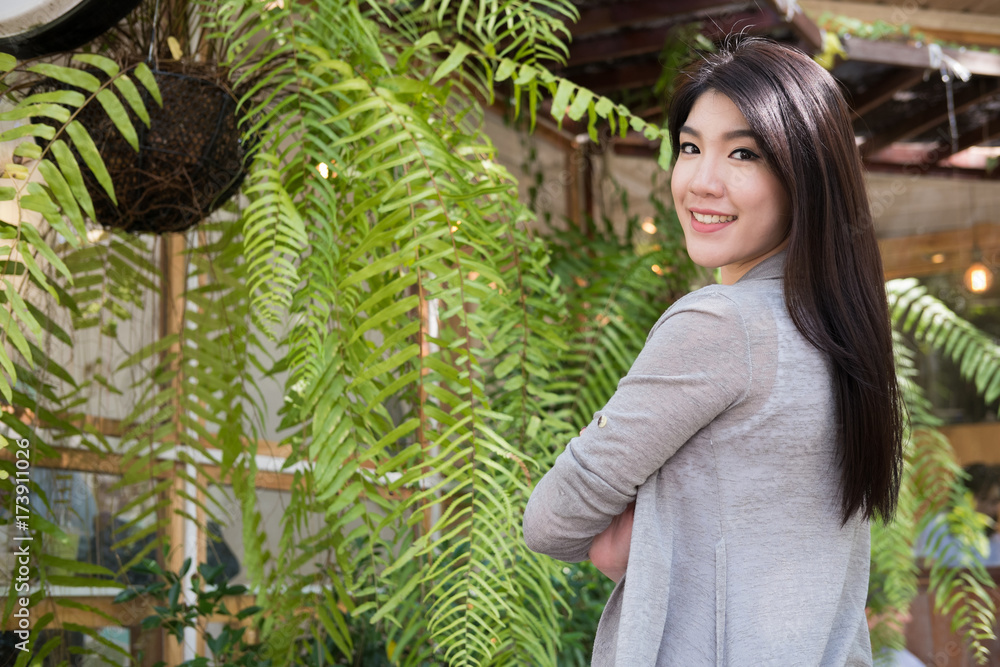 asian woman pose at outdoor cafe. young female adult with natural make-up relax at coffee shop. attractive teenager smile with happiness in garden asian woman pose at outdoor cafe. young female adult with natural make-up relax at coffee shop. attractive teenager smile with happiness in garden